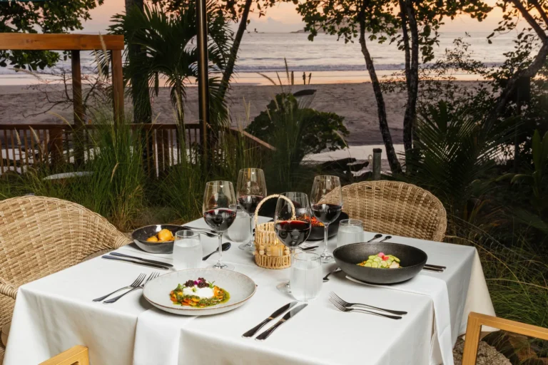 A table at Yemaya Restaurant facing the beach at sunset